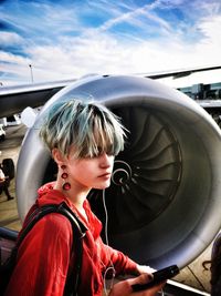 Girl looking at airplane