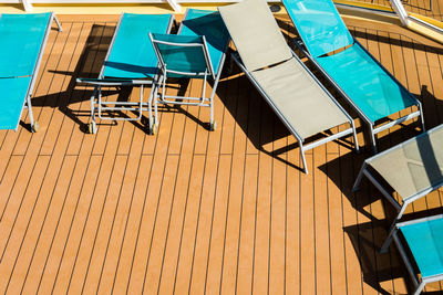 Chairs and tables against blue sky