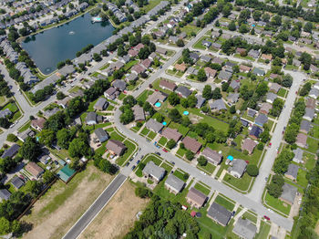 High angle view of trees and buildings in city