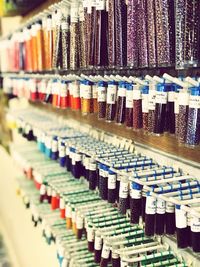 Multi colored bottles on shelf