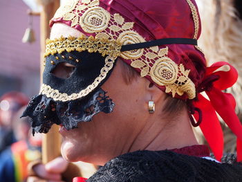 Close-up of woman wearing masquerade mask