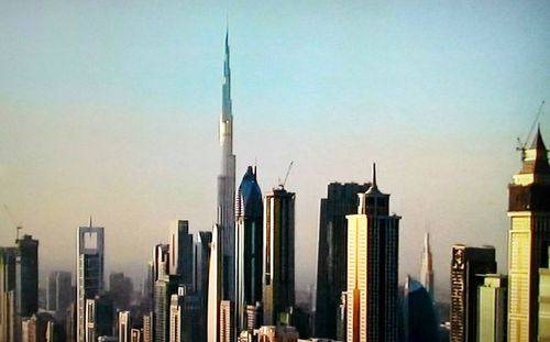 Panoramic view of buildings in city against sky