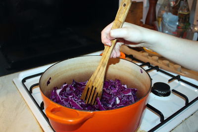 Close-up of person preparing food in bowl