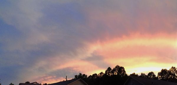 Low angle view of cloudy sky at sunset