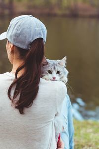 Midsection of woman with cat