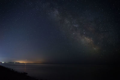 Scenic view of sea against sky at night