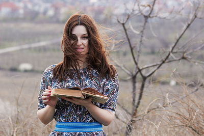 Young woman reading book