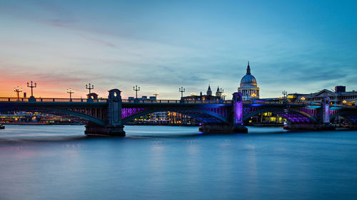 Bridge over river at dusk