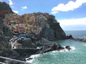View of sea with lighthouse in background