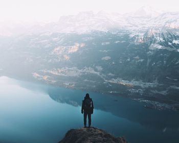 Rear view of man looking at mountains