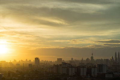 Cityscape against clear sky during sunset