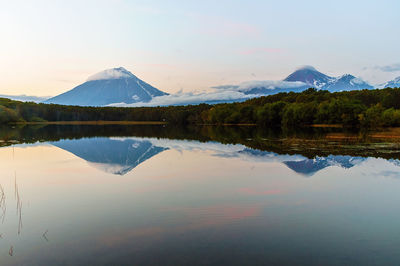 Scenic view of lake and mountains against sky
