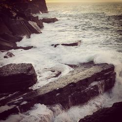 Waves splashing on rocks