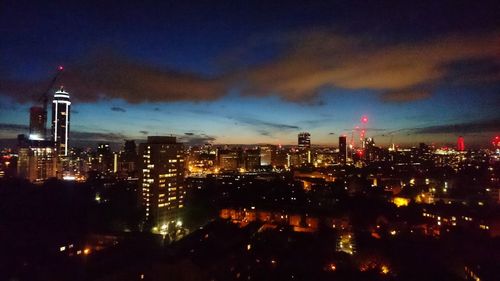 Aerial view of city lit up at night