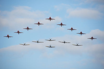 Low angle view of airshow against sky