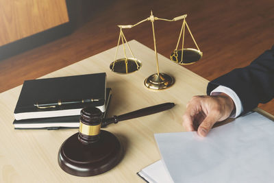 High angle view of man in pen on table