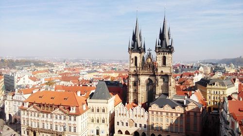 Cathedral and buildings in against sky