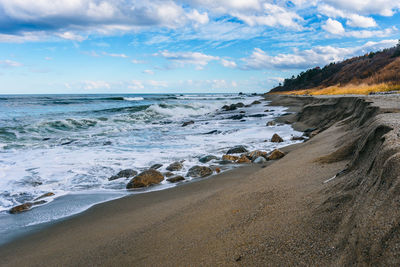 Scenic view of beach against sky