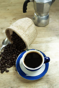 High angle view of coffee cup on table