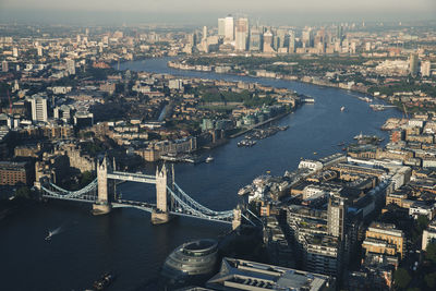 High angle view of river and buildings in city