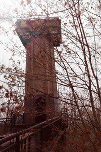 Low angle view of old tower against sky