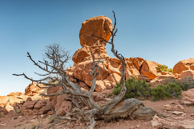 Low angle view of rock formations against clear sky