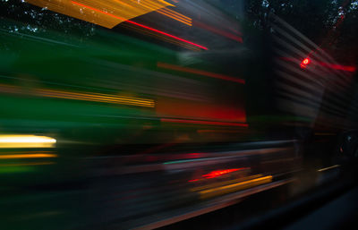 Light trails on road in city at night