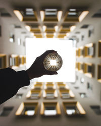 Close-up of hand holding illuminated light