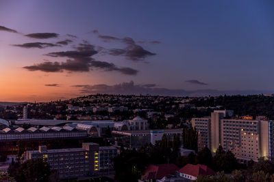 High angle view of buildings against sky at sunset