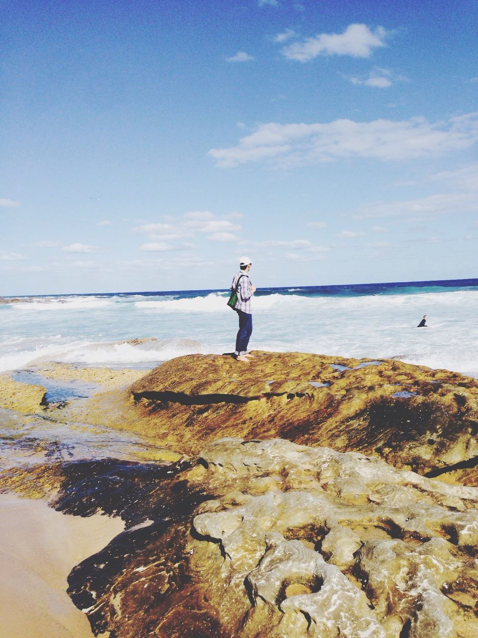 sea, water, beach, horizon over water, tranquil scene, scenics, tranquility, sky, shore, beauty in nature, nature, sand, idyllic, blue, cliff, rock - object, rock formation, coastline, vacations, remote