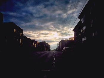 Road against cloudy sky at sunset