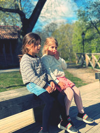 Girls sitting on bench