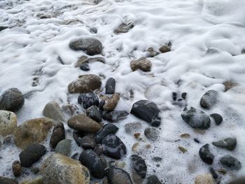 Close-up of stones in sea