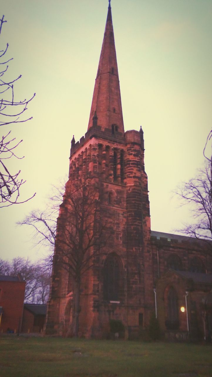 architecture, built structure, building exterior, religion, place of worship, spirituality, church, low angle view, history, sky, tree, cathedral, clear sky, old, temple - building, outdoors, no people, steeple