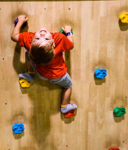 Boy playing with umbrella