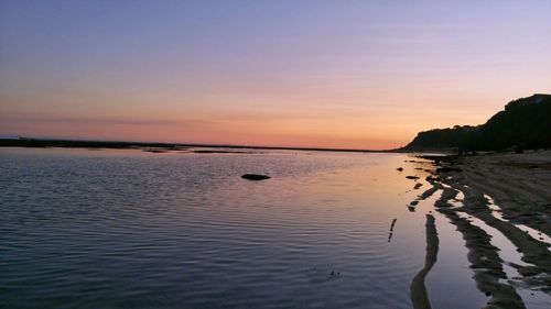 Scenic view of sea against sky at sunset