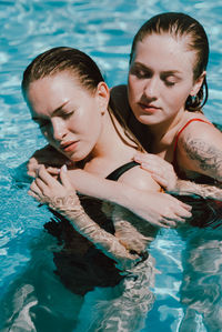 Side view of women swimming in pool