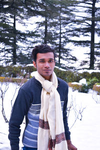 Portrait of young man standing on land