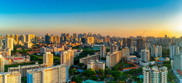 High angle view of modern buildings in city against sky