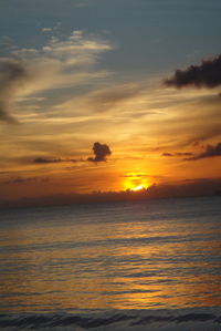 Scenic view of sea against orange sky