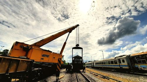 Train on railroad track against sky