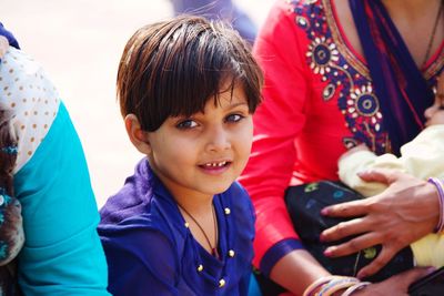 Portrait of smiling boy and woman