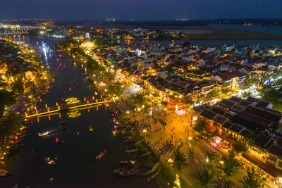 High angle view of illuminated city buildings at night