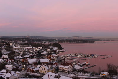 High angle view of town against sky during sunset