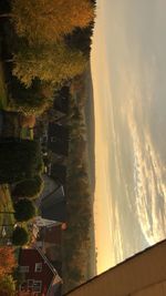 Scenic view of townscape against sky during sunset