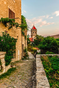 Footpath amidst buildings in town