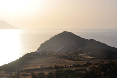 Scenic view of sea against clear sky during sunset