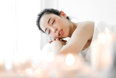 Portrait of beautiful woman lying down