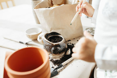 Midsection of woman preparing food