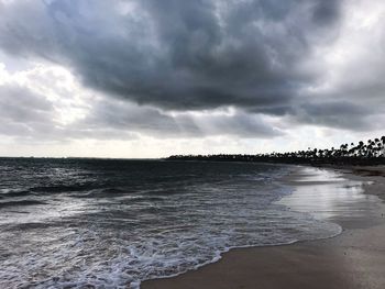 Scenic view of sea against cloudy sky